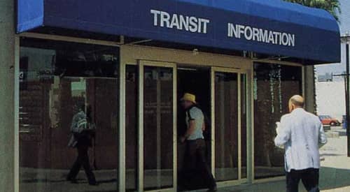 Office with a blue awning with the words transit information